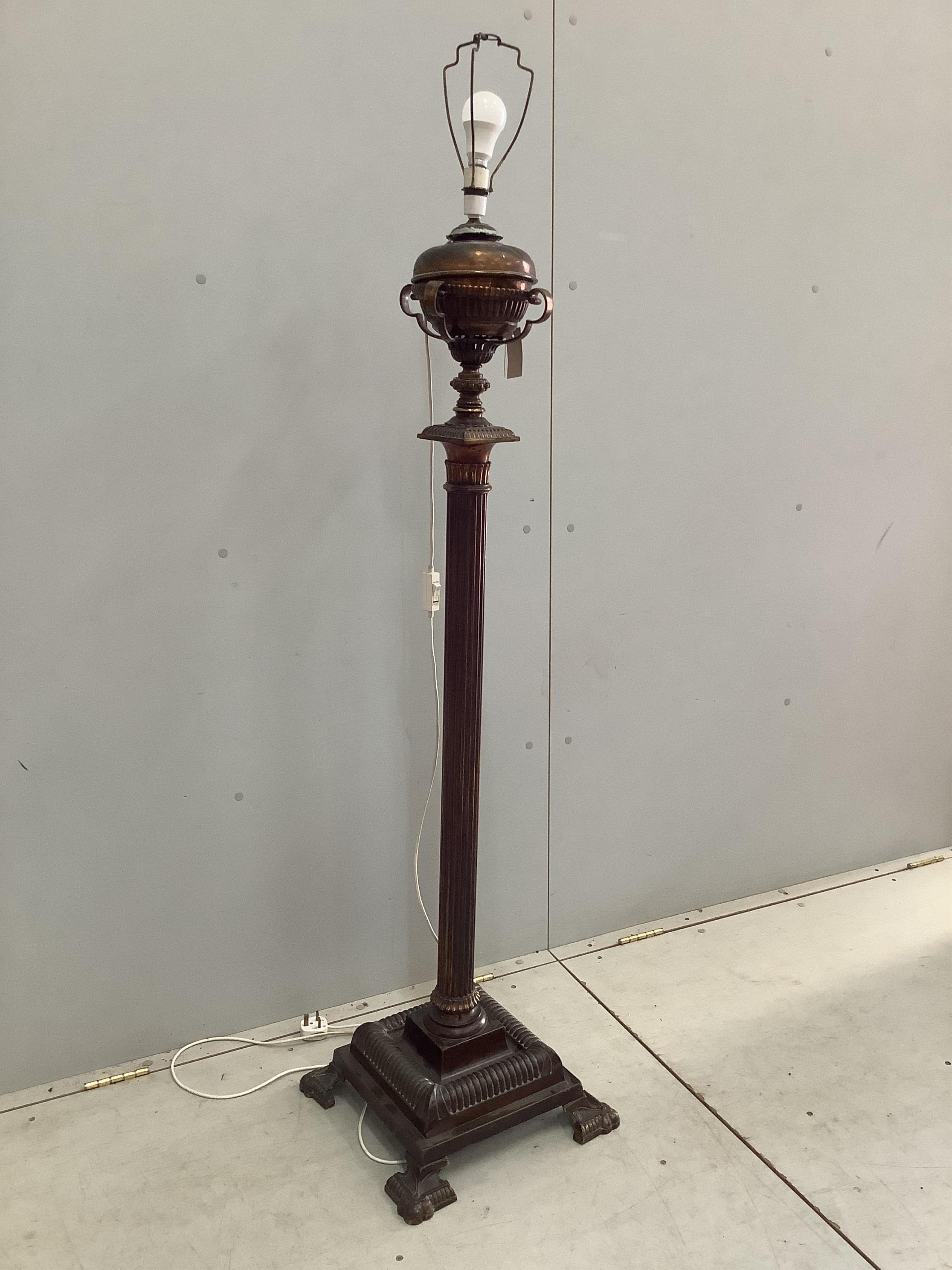 A Victorian style brass telescopic oil lamp standard converted to electricity, height 140cm